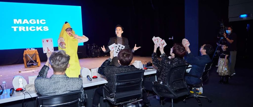 The Gents Magician performing close-up magic trick