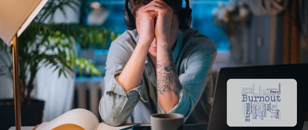 a man with headphones and headphones on a laptop computer