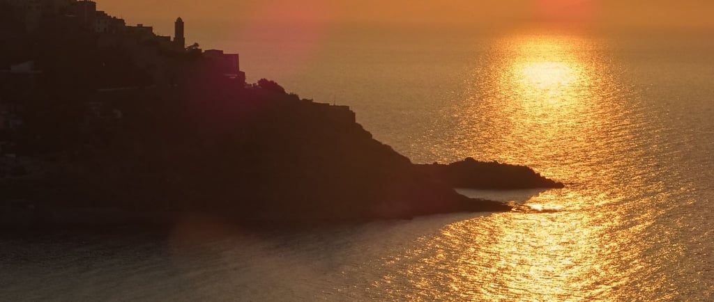 a sunset over a body of water