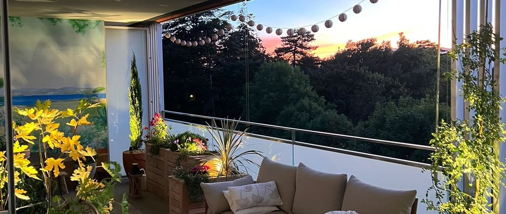 a couch sitting on a patio with a view of the ocean