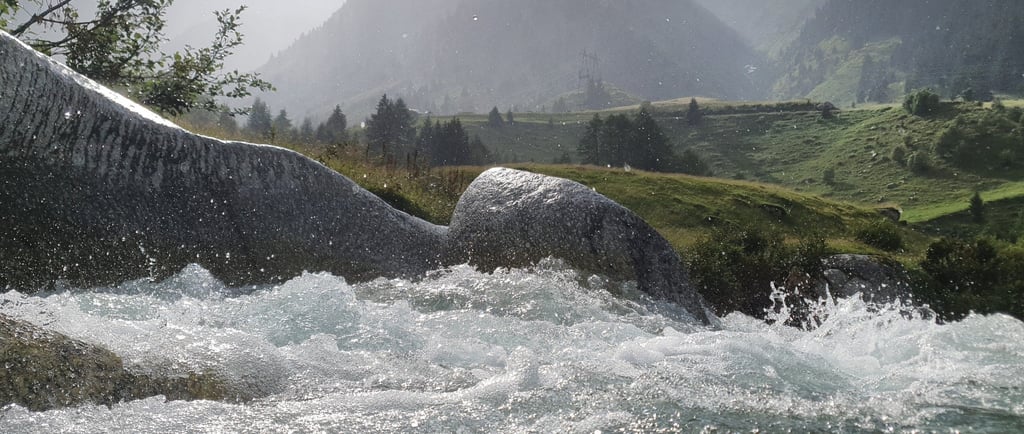 a river with a mountain in the background