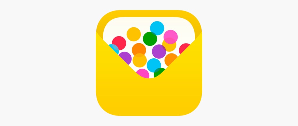 a yellow envelope with balloons floating in the air