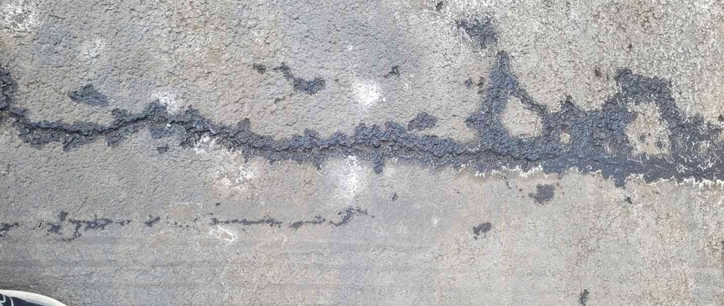 cracks in asphalt after winter
