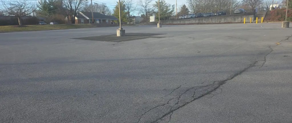 a parking lot needs sealcoaitn and striping