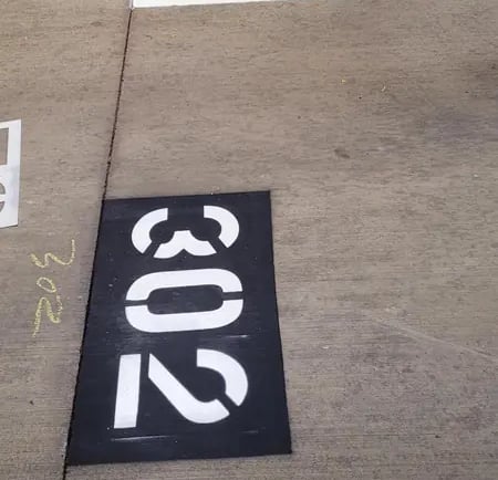 Parking stencil number