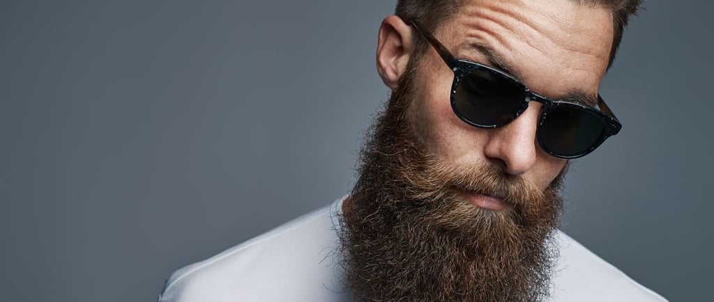 a bearded bearded man with a beard and sunglasses