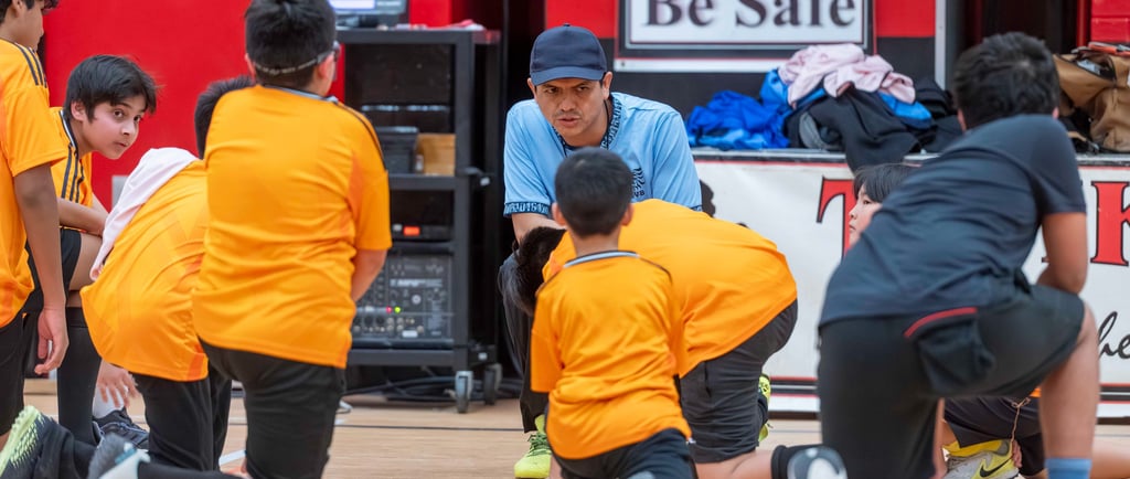 MVB F.C, coach instructs players at Mississauga Soccer School