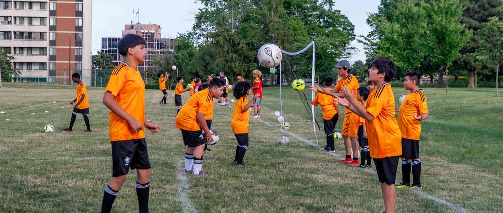 Young player practicing ball mastery repeatedly at MVB FC soccer school