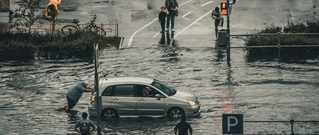 a car is parked in a flooded street