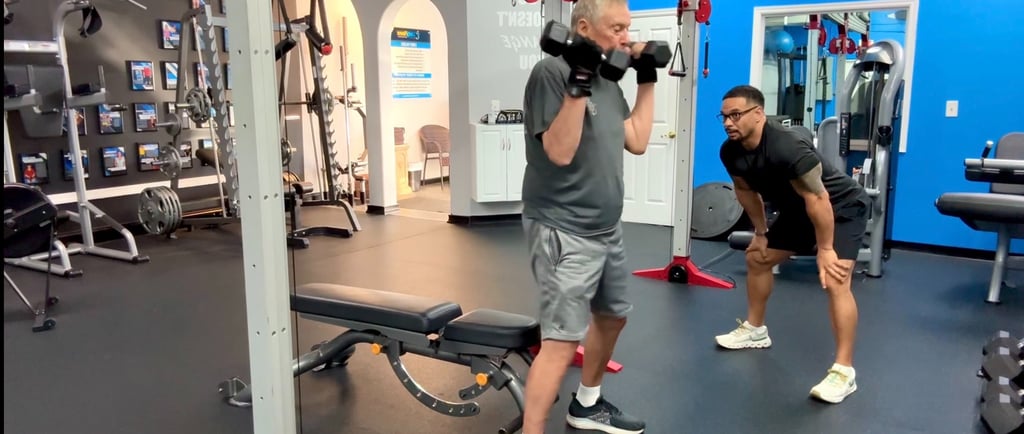 senior personal trainer in palm beach gardens cc matthews helps elderly client exercise