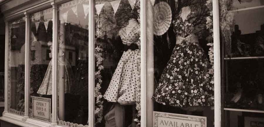 A picture of a storefront with mannequins in Cambridge, UK, Creator: Slawek Dejneka