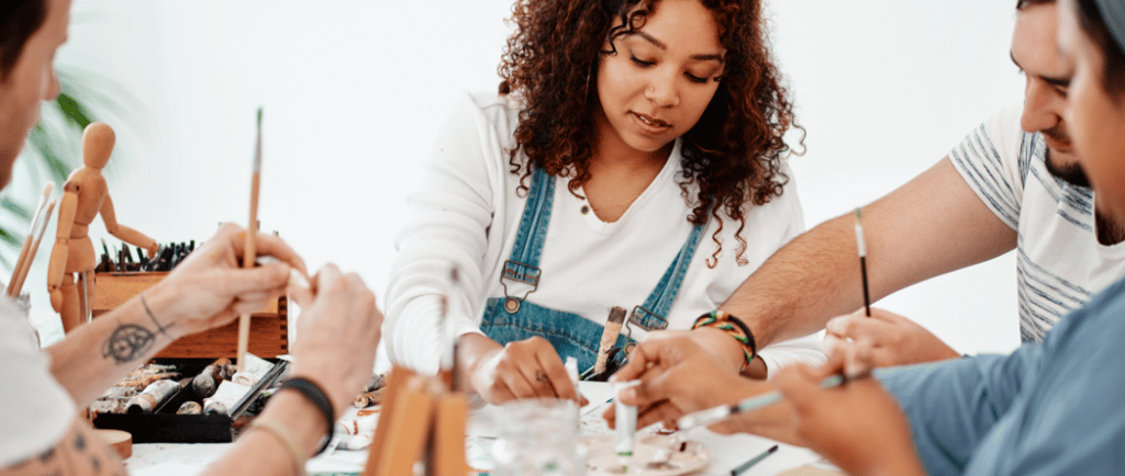 Group of young adult artists working together