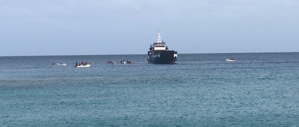 longboats unloading and loading in remote pacific islands