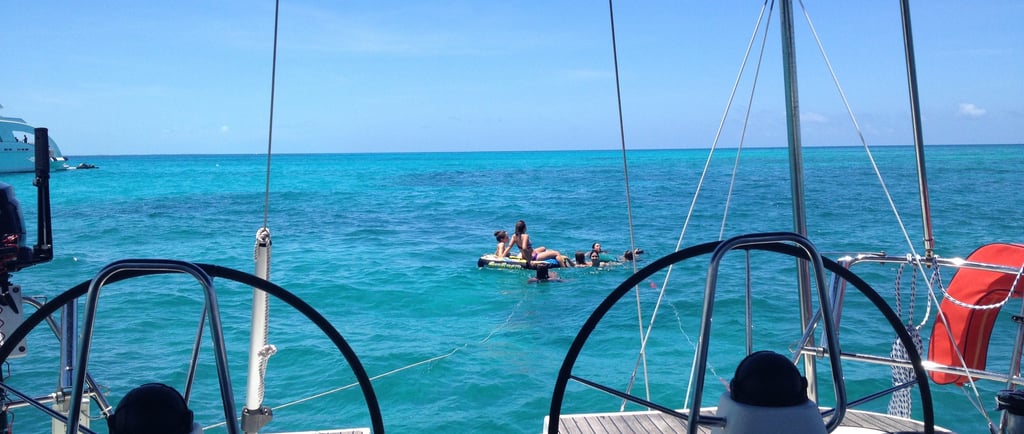 a boat with people on it in the ocean