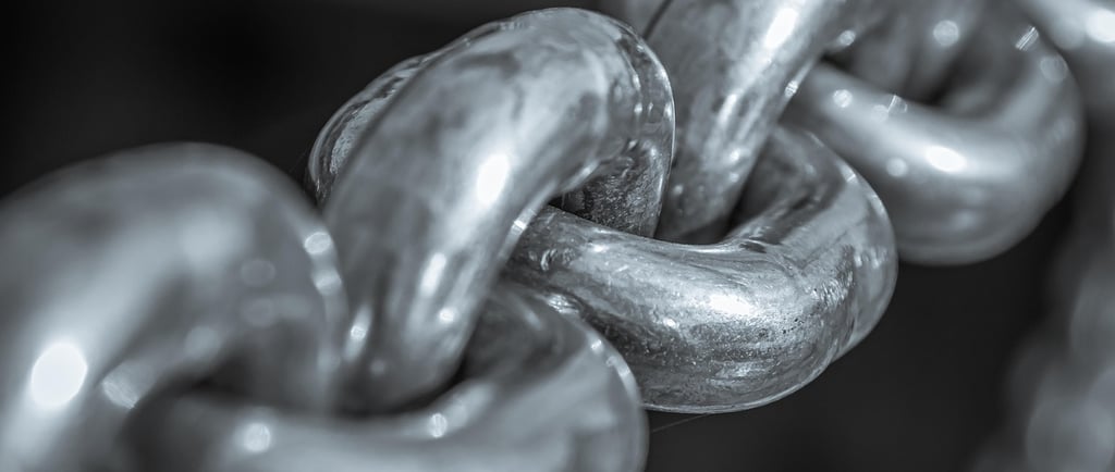 A close-up of a silver chain linked together..