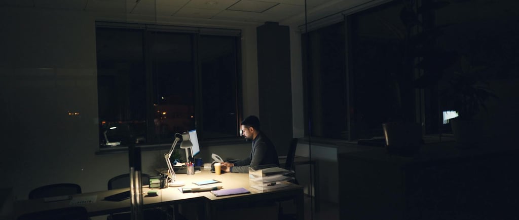 an alone person in an empty office that hints towards how burnout and meaninglessness can be dangerous