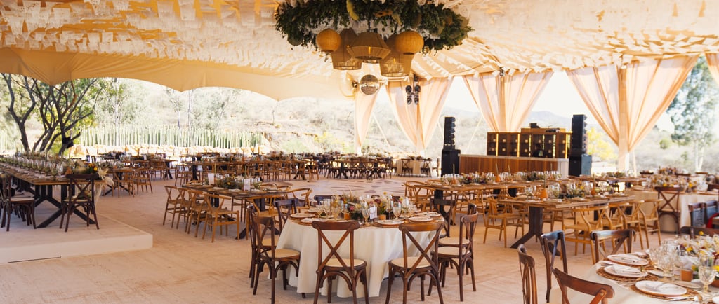 a large tent with tables and chairs and a table