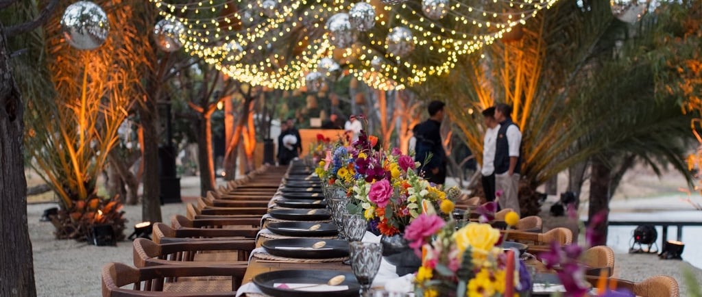 a long table with a long table set for dinner