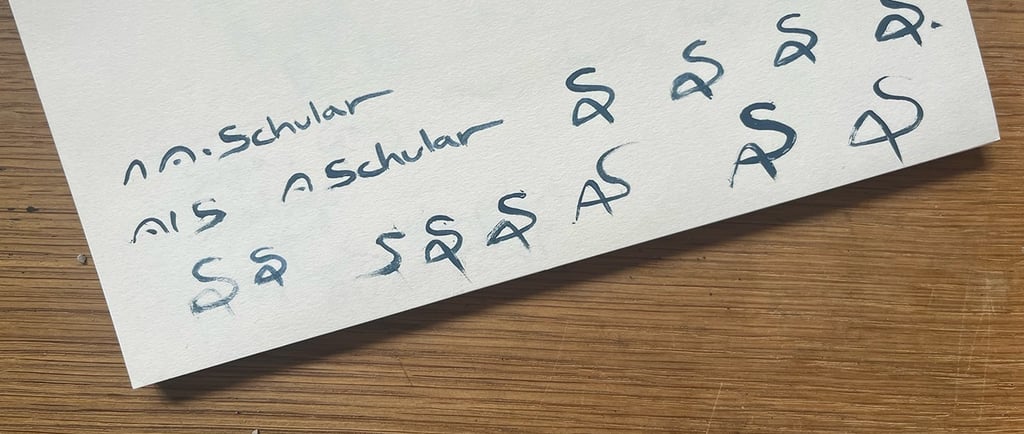 Practicing new signatures over and over on a piece of scrap paper