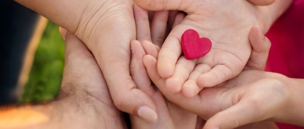 a group of people holding hands in a circle