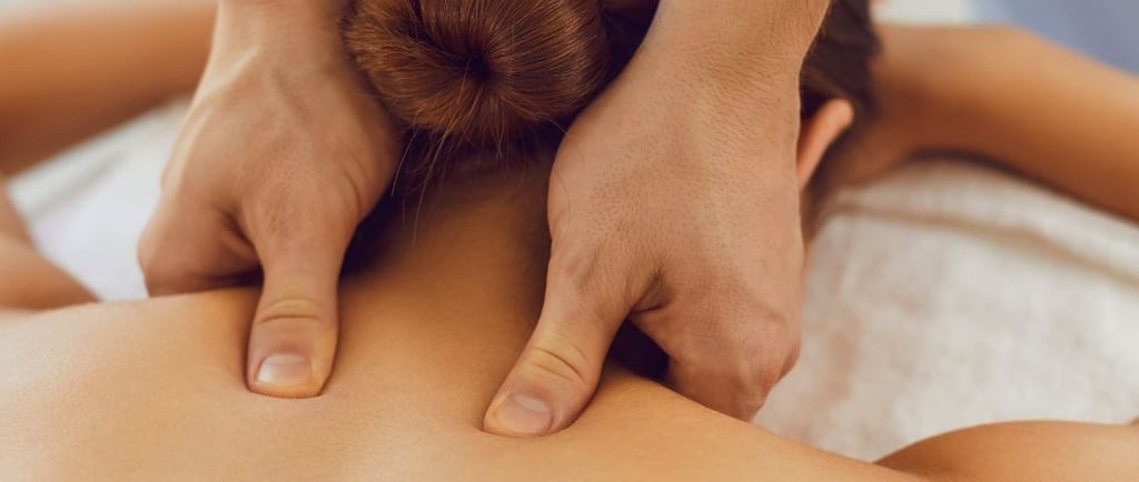 a woman getting a massage at a spa