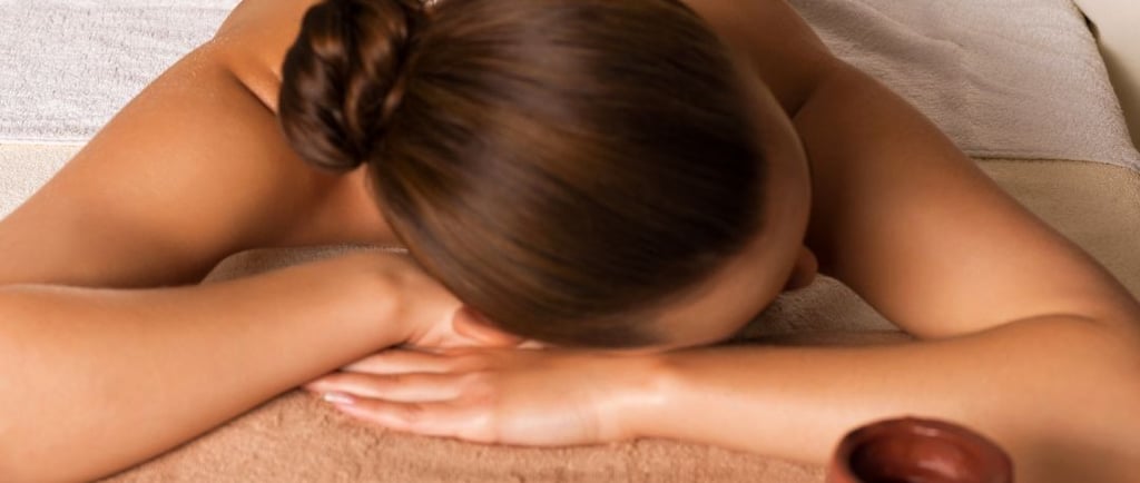 a woman getting a massage at a spa