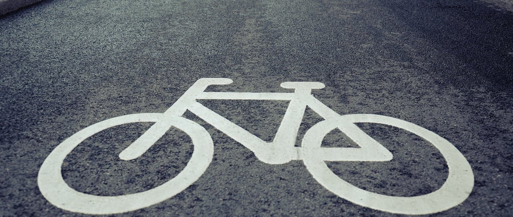 a bicycle lane lane sign on a street
