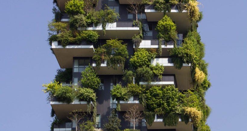 modern high rise building with plants growing symbiotically