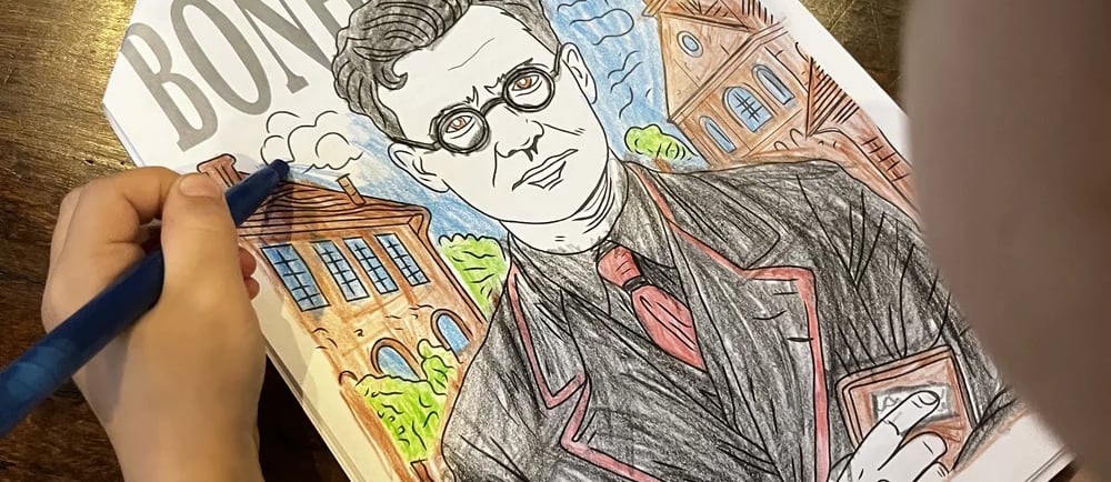 Child coloring in a Bonhoeffer drawing
