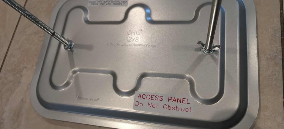 Photo of a kitchen exhaust access panel used to allow access to properly clean a section of ductwork