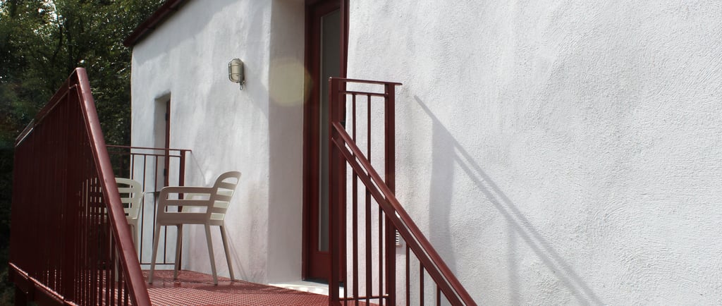A private balcony with seating
