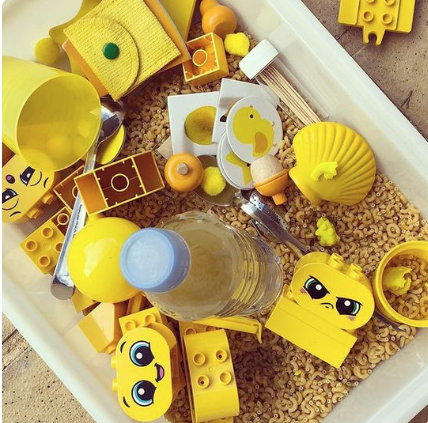 a container filled with legos and legos