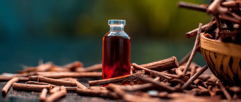 Manjistha roots with a bottle of red extract on a natural background representing the Ayurvedic herb