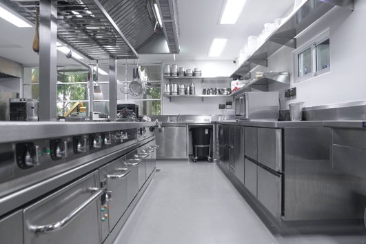 a kitchen with stainless steel appliances and stainless steel appliances