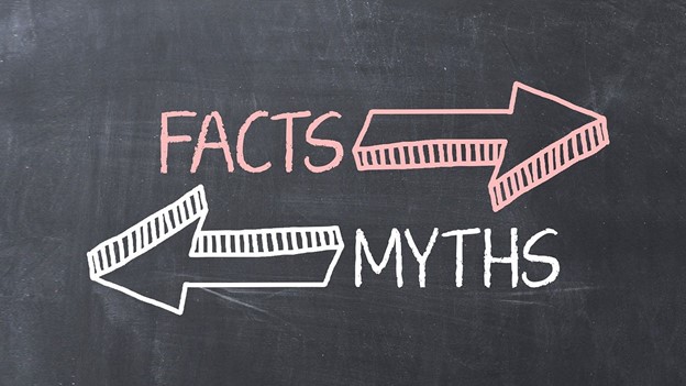 Facts with arrow pointing right, myths with arrow pointing left, on chalkboard background