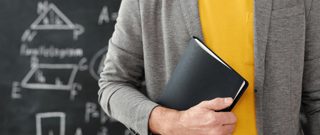 Man holding a notebook at his side, symbolizing ADHD, working memory struggles
