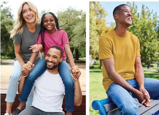 a man and woman sitting on a bench in a park