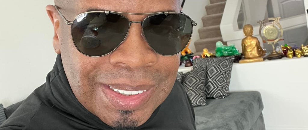 a man with a black hair and sunglasses