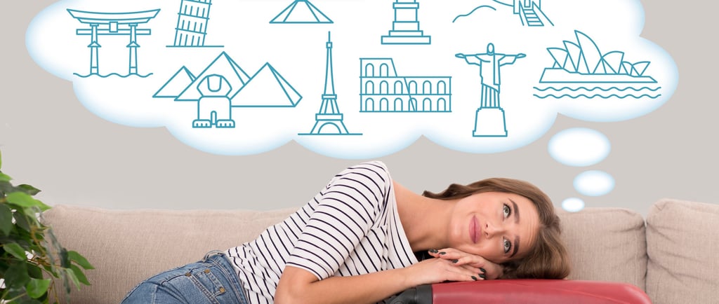 a woman is sitting on a couch with a suitcase