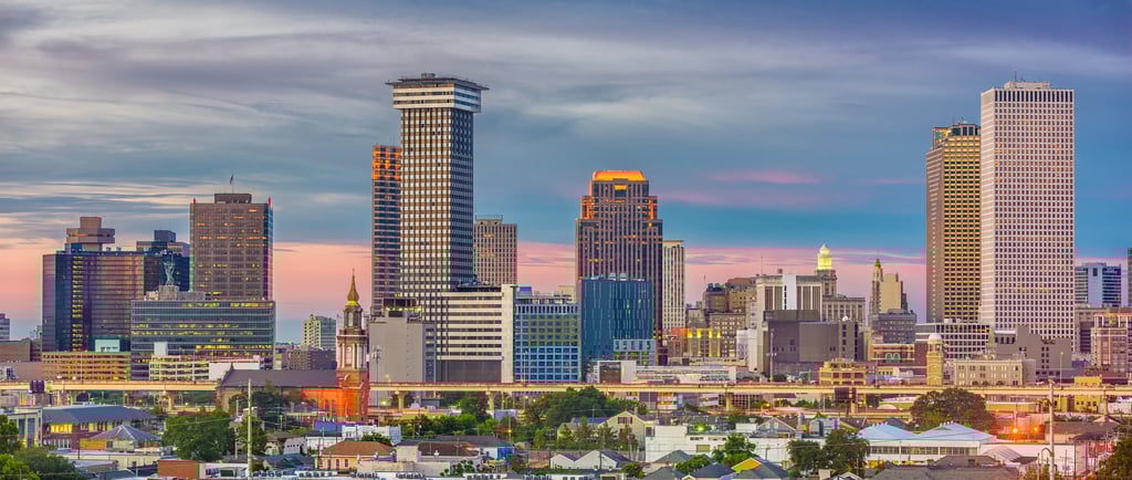 a city skyline with tall buildings and a clock tower