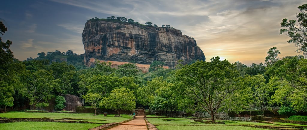 a path leading to a large rock formation