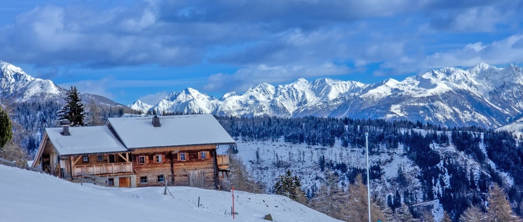 a house with a mountain view of a cabin