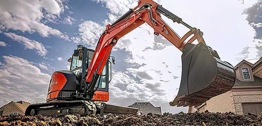 Excavator digging at a construction site, showing the benefits of renting construction equipment