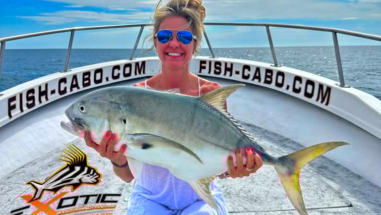 a woman holding a fish fish on a boat
