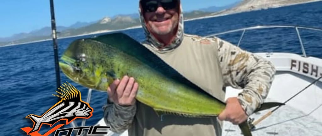 a man holding a fish on a boat