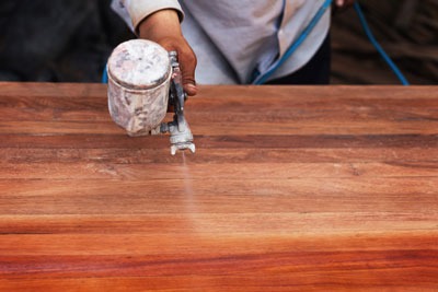 a person using a grinder on a wooden table