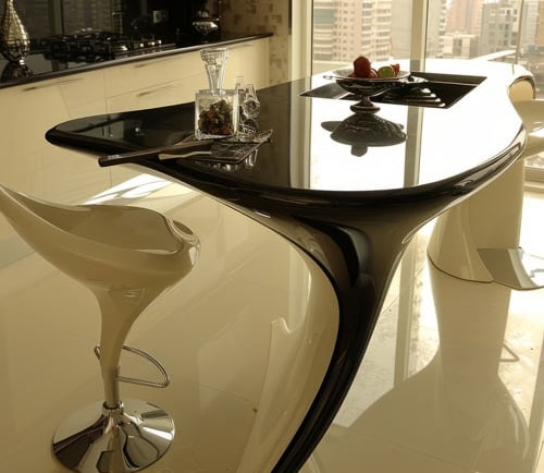 a modern kitchen with a table and chairs