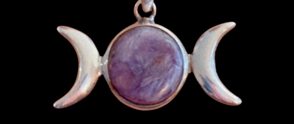 Sterling silver triple moon pendant with a purple charoite center stone