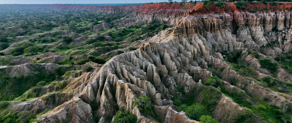 a mountain range with a view of a valley