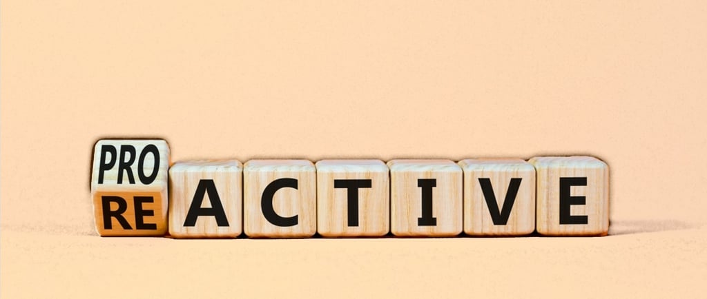 wooden blocks with the word changing from reactive to proactive